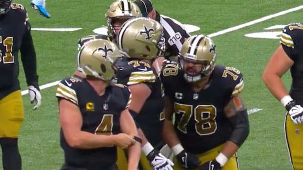 Saints center Erick McCoy shouts at quarterback Derek Carr after he was sacked.